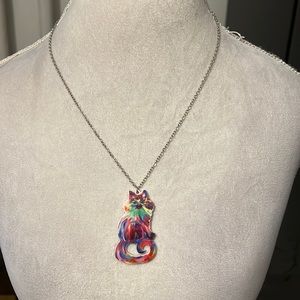 Long cat pendant necklace with a tye dye look to it